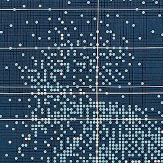 Detail of a silk scarf: pale dots scattered across indigo