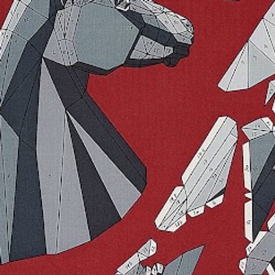 Detail of a silk scarf: faceted grey shapes on red